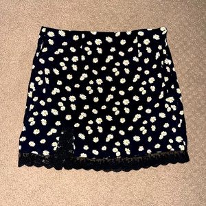 Brand new forever 21 black mini skirt with daisy's and lace